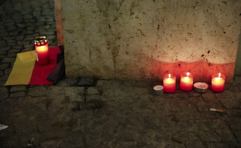 A candle is burning on a German national flag near the site where a truck ploughed through a crowd at a Berlin Christmas market
X90145 / REUTERS