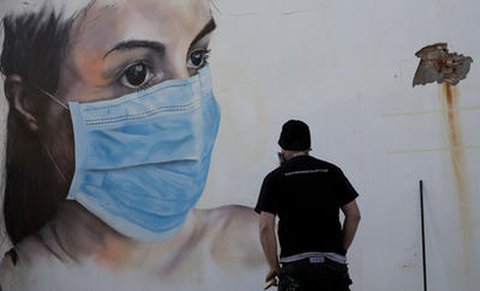 Mundschutz-Graffiti in Belgien. 